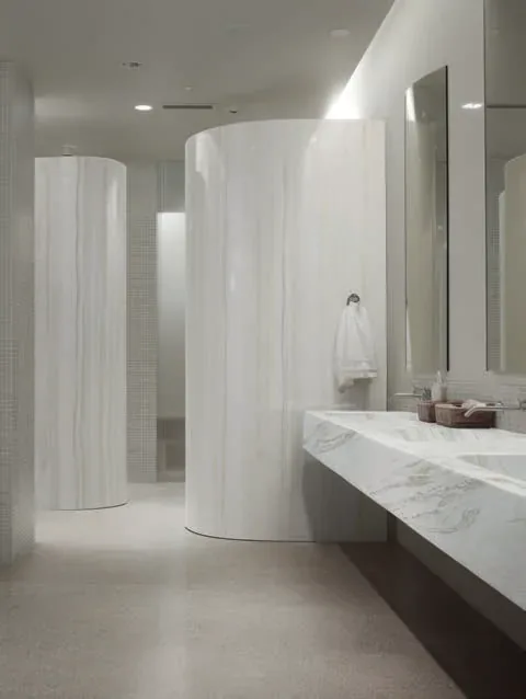 Blat umywalkowy z Corian® Vasto Greige i Travertine Firenze w łazience z kolumnami
