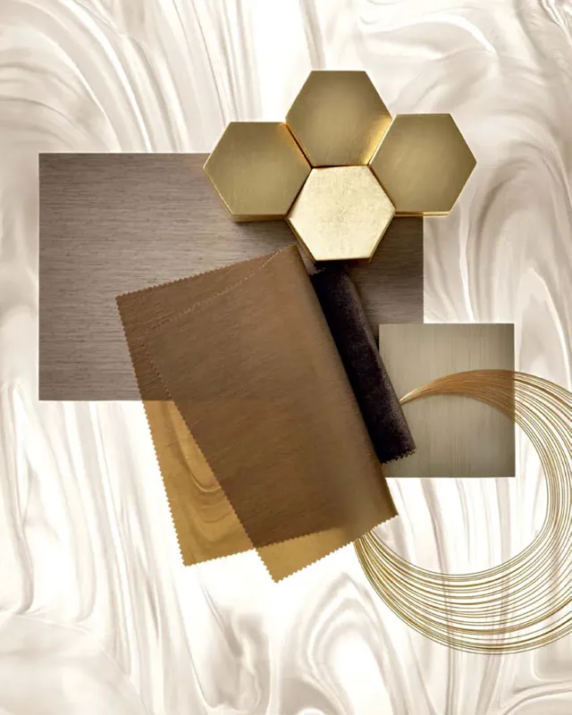 Próbka Corian® o mlecznym żyłkowaniu z mosiężnymi i metalowymi detalami