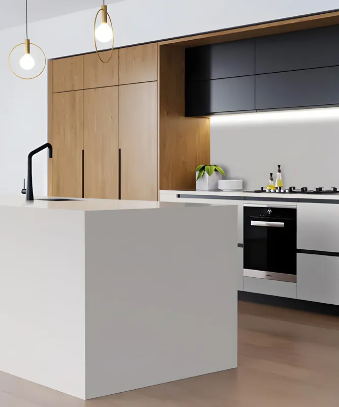 Biała wyspa kuchenna z blatem solid surface opadającym do podłogi